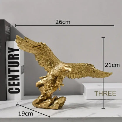 Creative golden flying eagle resin desk decoration with detailed feather texture and metallic finish on rocky base