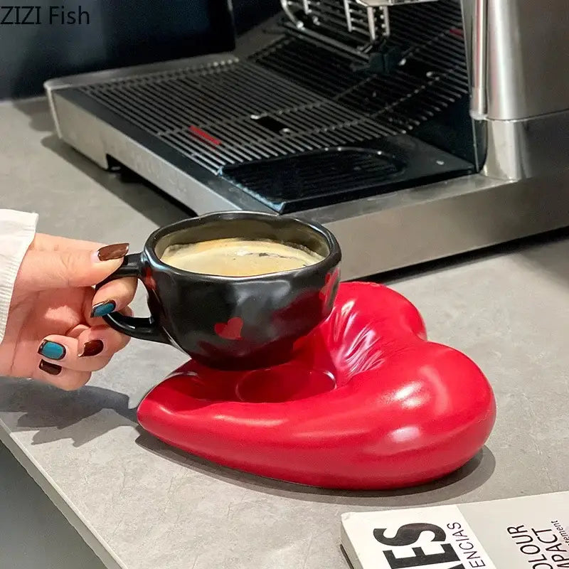 Black ceramic heart porcelain coffee cup with glossy finish and red heart decals on red heart-shaped coaster decorbites creative heart