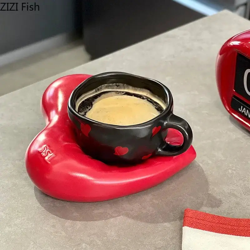 Black ceramic creative heart porcelain coffee cup with red heart decals on a glossy red heart porcelain coaster decorbites creative heart
