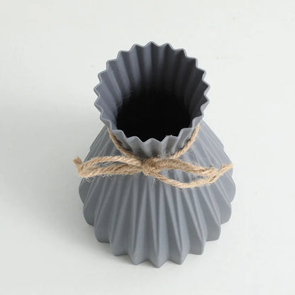 Gray ceramic flower bottle with fluted scalloped rim and natural twine tied waist dry flower bottle type