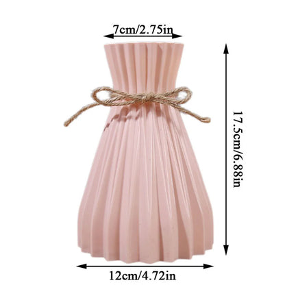 A delicate pink pleated ceramic flower bottle with rustic twine bow, ideal as a dry flower bottle type