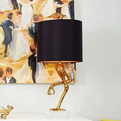 Golden bird-shaped table lamp with black satin shade and clear acrylic base from decorbites creative ostrich table collection