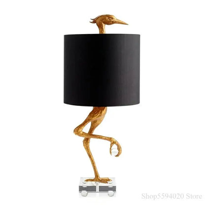 Golden bird-shaped table lamp with black cylindrical shade and crystal base from decorbites creative ostrich table collection