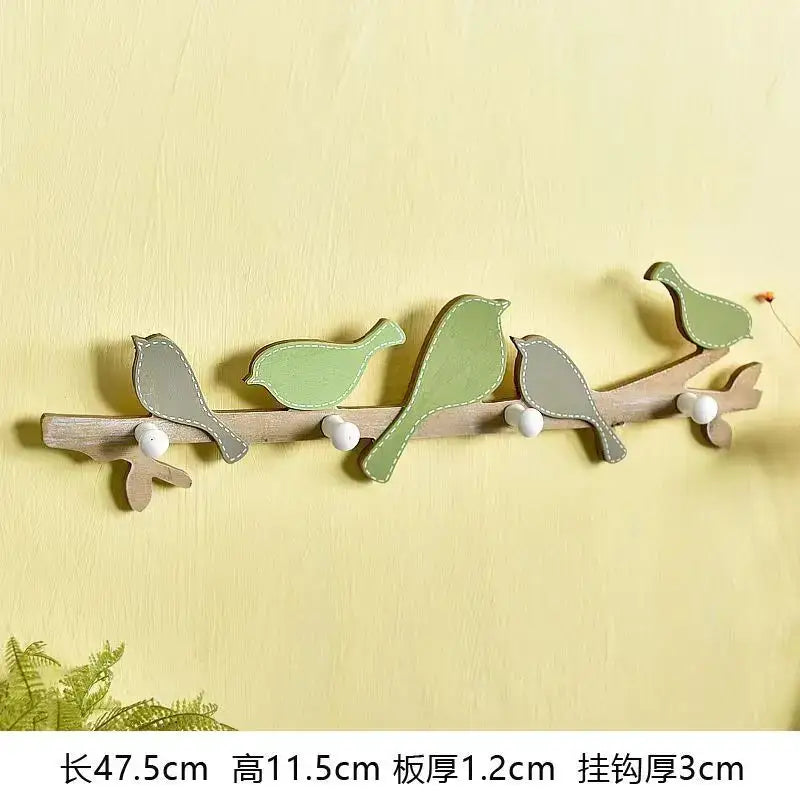 Wooden wall-mounted birds coat rack in green and beige with white bead hooks for entryway decorbites birds coat rack