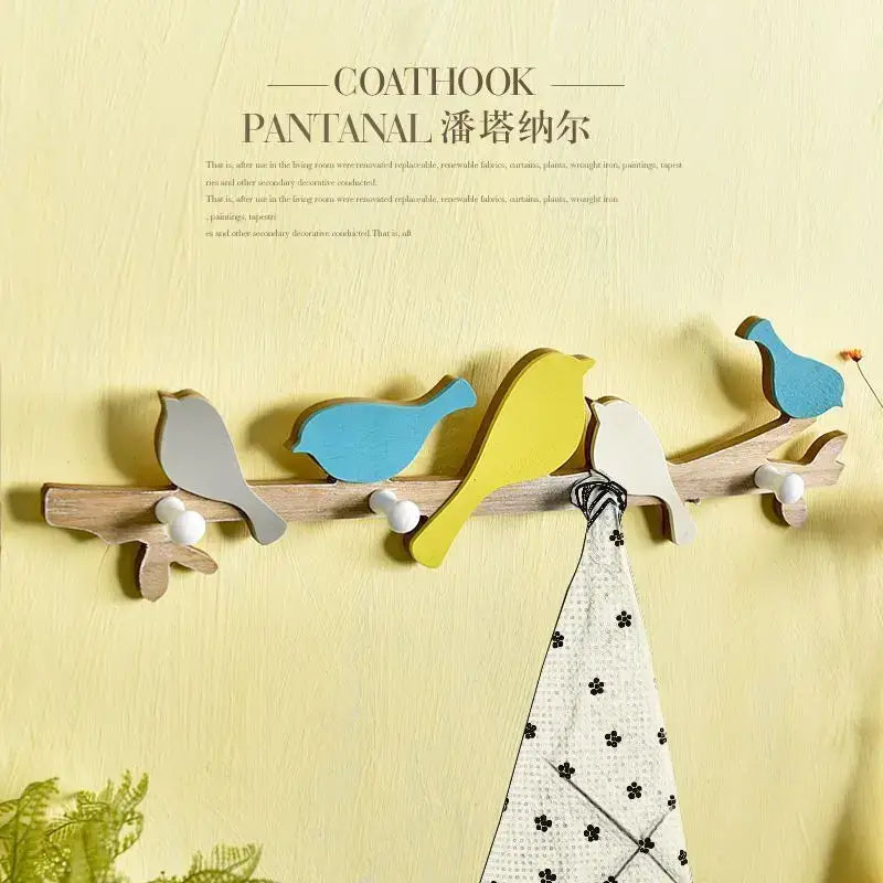 Creative wooden birds coat rack in green and beige features painted gray, blue, yellow, and white decorbites birds coat hooks