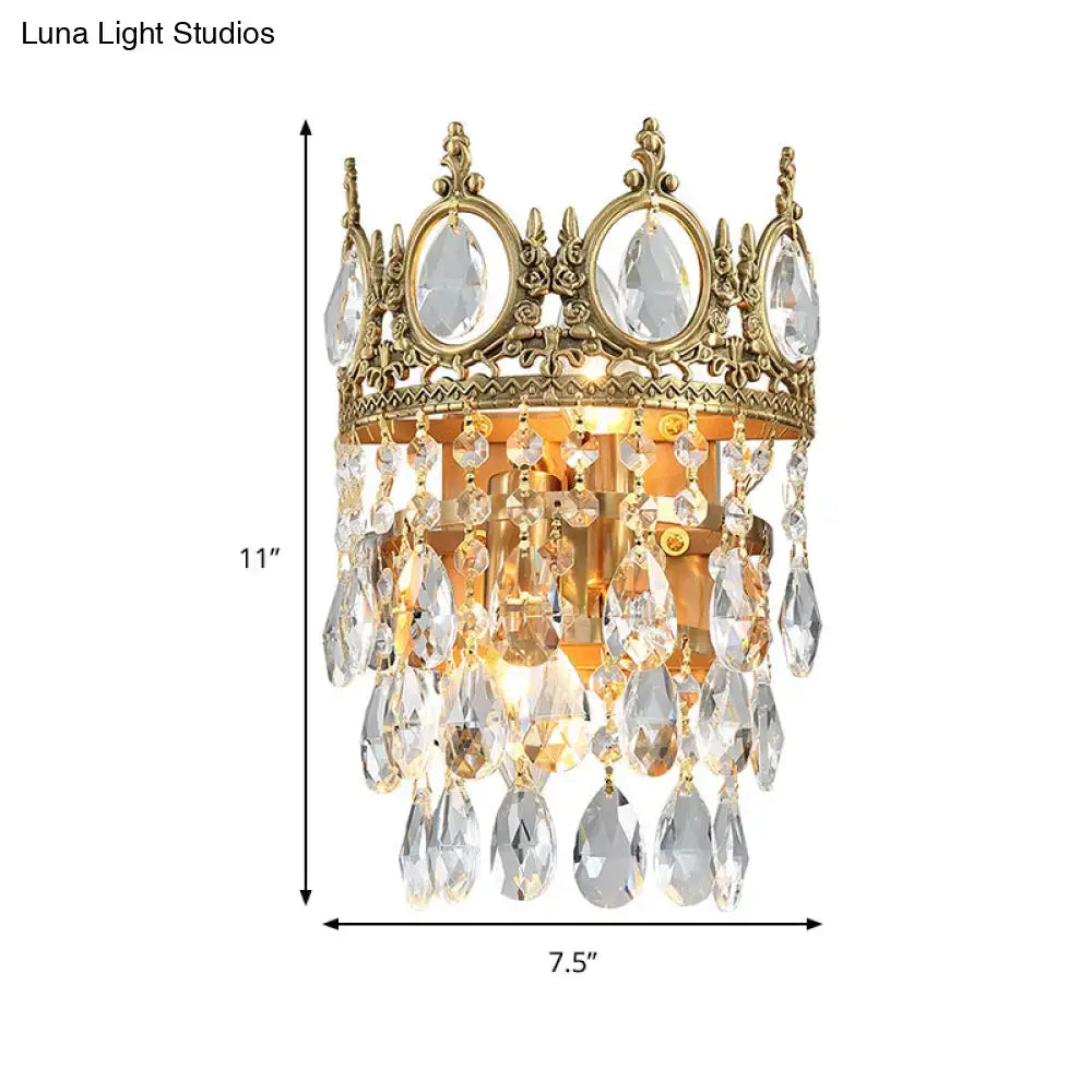 Gold-toned crown aged brass round wall mounted lighting with clear crystal prisms for bedroom decor