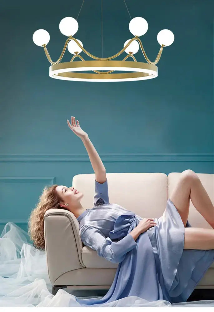 Gold-toned crown design chandelier with six white globe lights for living room decorbites crown design gold lighting