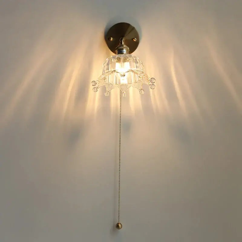 Clear crystal glass led wall sconce with brass finish and pull chain for decorbites crown glass bedroom fixture