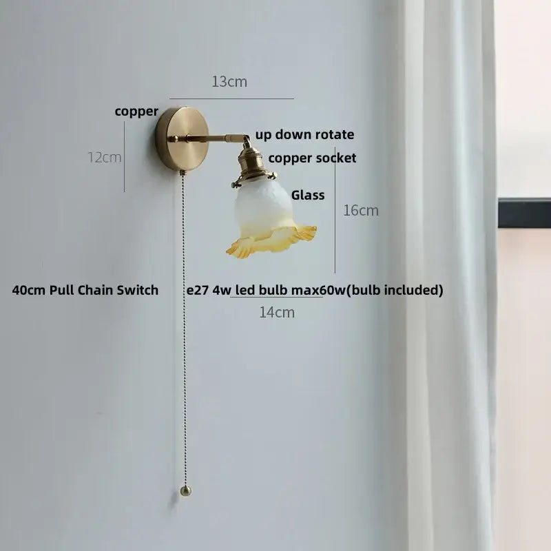 Antique brass-finished decorbites crown glass led wall sconce with frosted glass and yellow floral detailing for bedroom