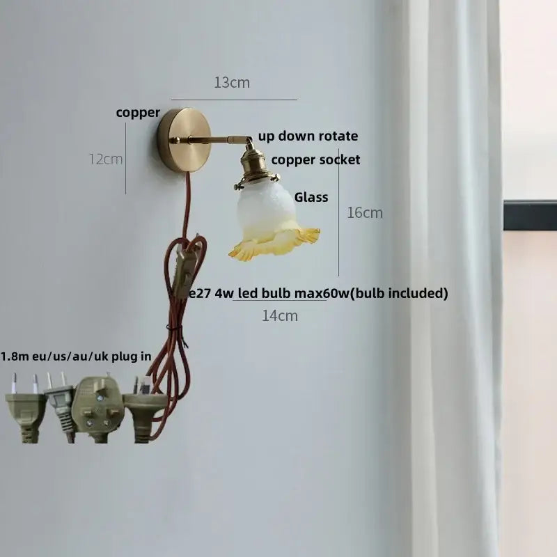 A vintage-style decorbites crown glass led wall light with copper sconce and frosted glass shade with yellow floral detailing