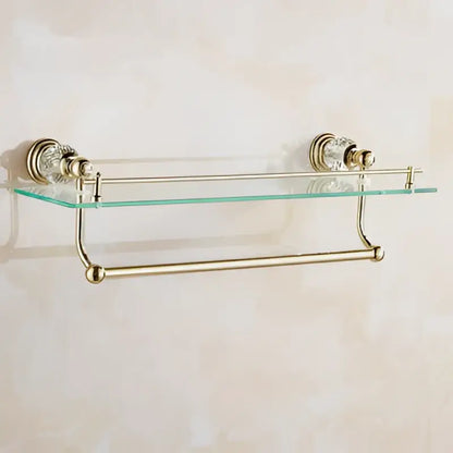 Gold-toned crystal bathroom accessories set with clear glass shelf and decorative crystal accents by decorbites brass