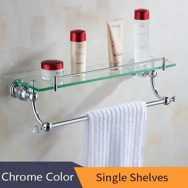 Chrome-finished bathroom shelf with glass top and towel bar complementing decorbites crystal brass gold bathroom decor