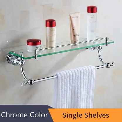 Chrome-finished bathroom shelf with glass top and towel bar complementing decorbites crystal brass gold bathroom decor