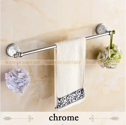 Chrome-finished bathroom towel rack with decorative wall-mounted brackets holding white towel for brass gold bathroom decorbites crystal brass accessory