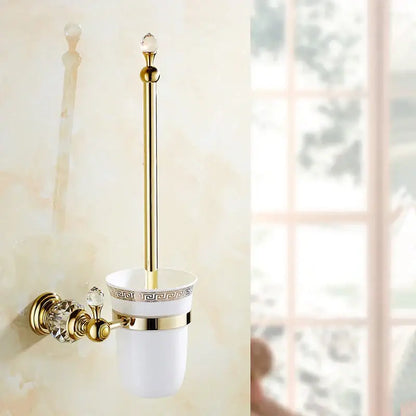 Gold-finished toilet brush holder with white ceramic cup featuring ornate greek key pattern and crystal accents for brass gold bathroom decorbites crystal brass