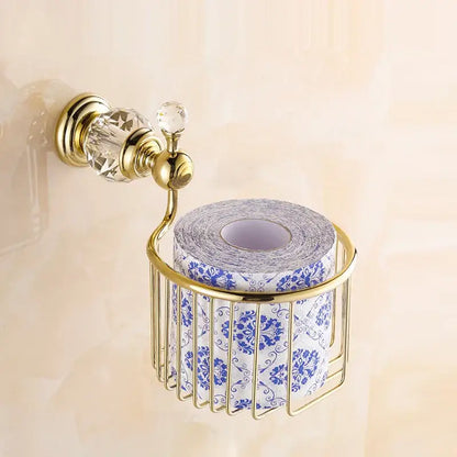 Crystal brass gold toilet paper holder with gold-toned brass and crystal accents holding blue floral toilet paper roll