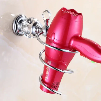 A vibrant red guangmin hair dryer with a glossy finish held in a crystal brass gold spiral holder for brass gold bathroom decorbites