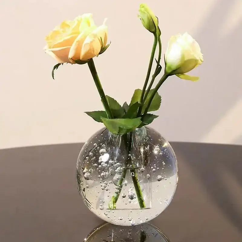 Crystal bubble ball vase filled with water and bubbles holding three pale yellow artificial flowers for desk decorbites crystal bubble