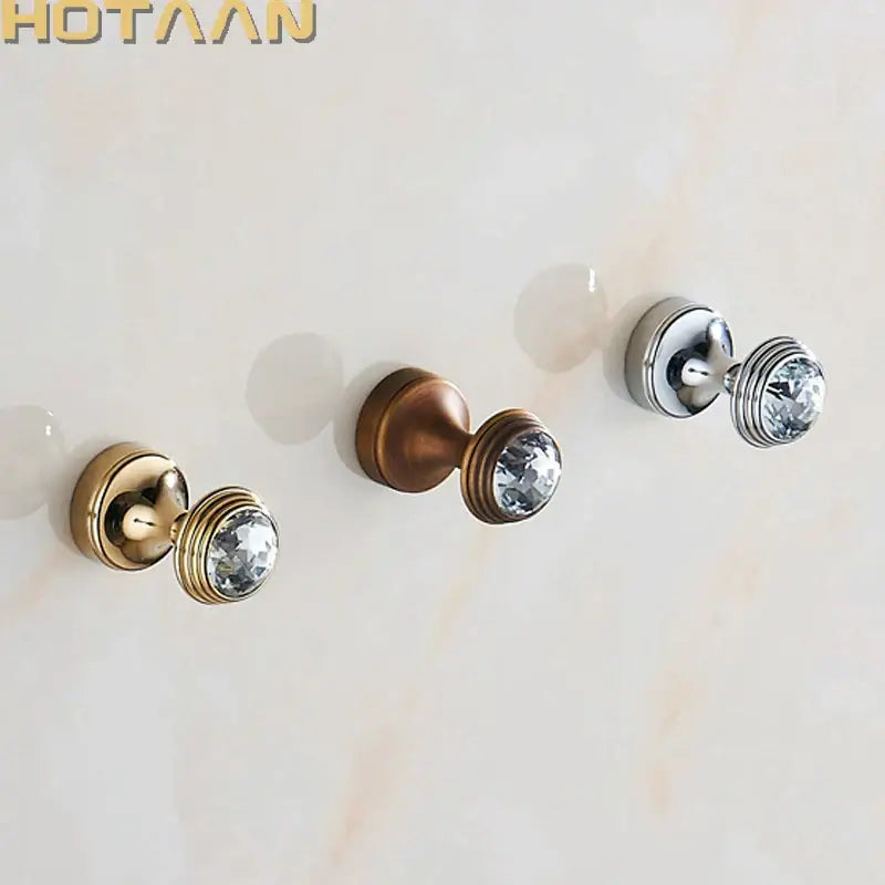 Crystal chrome wall hook set by decorbites features three decorative hooks in gold, antique brass, and chrome with faceted crystals
