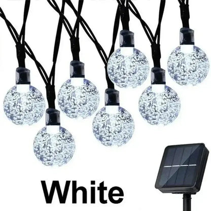 White spherical fairy solar string lights with sparkling bubble interior and black caps for decorbites crystal fairy patio decor
