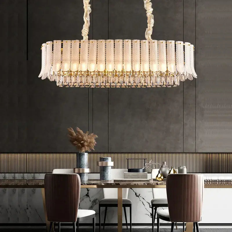 A modern gold-toned decorbites crystal feather ceiling pendant with frosted glass tubes and crystal droplets for living room decor