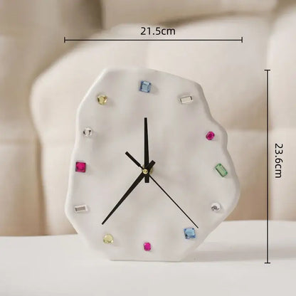 A white ceramic crystal geometric wall clock with colorful gemstone markers and black hands for living room decorbites decor