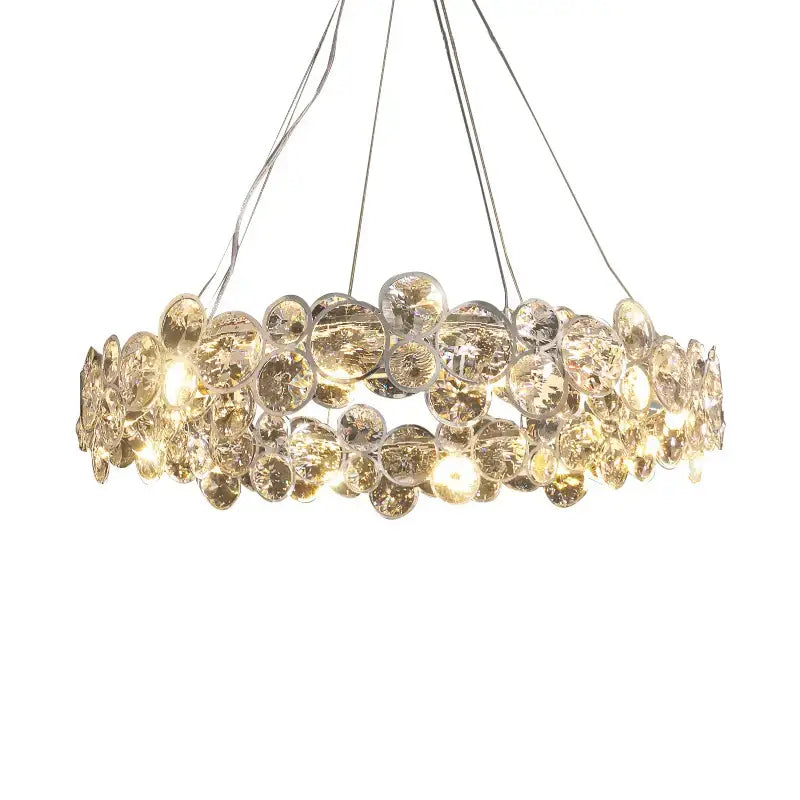 A modern decorbites crystal magic pendant light with layered translucent crystal discs for dining room decor