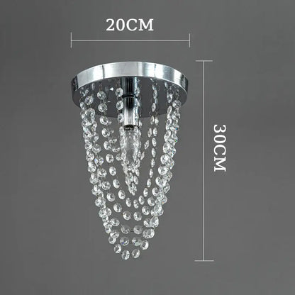 A sleek chrome ceiling light with cascading clear crystal beads from decorbites crystal sun flower chandelier