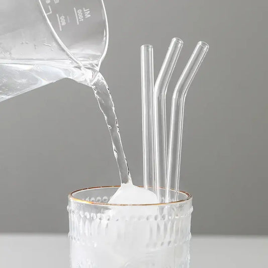 Curved clear decorbites glass straws in a textured white tumbler for eco friendly reusable kitchen use