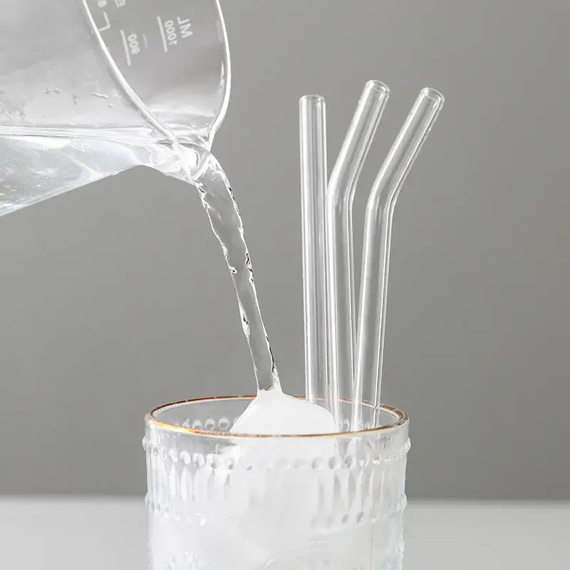 Curved clear decorbites glass straws in a textured white tumbler for eco friendly reusable kitchen use