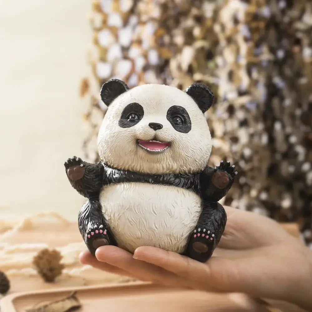 Adorable black and white panda baby figurine with textured fur smiling face and pink-tipped paws for living room decor