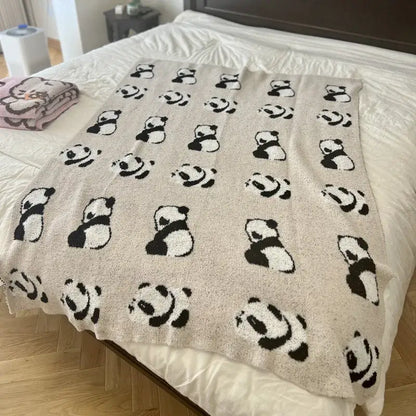 Cute cartoon pink and beige cat flannel blanket with a soft beige knit featuring black and white panda faces