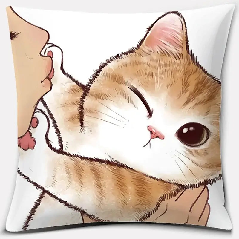 A soft white cushion with a cute cat kiss illustration of an orange tabby and a person perfect for bedroom decor