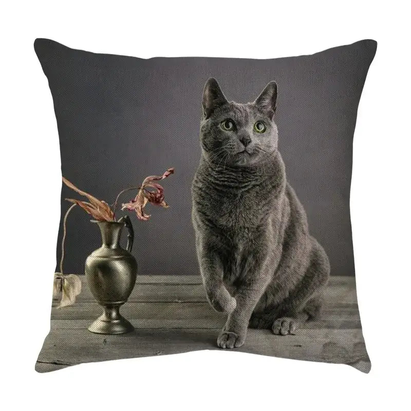 Gray Russian Blue cat sofa cotton linen cushion cover with cute cat sofa print beside antique vase on wooden surface
