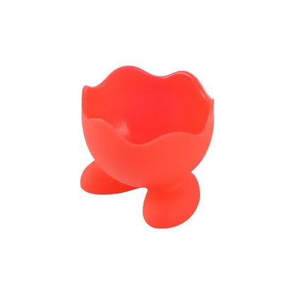 Bright red silicone egg cup holder with flower-like rim and three rounded feet for kitchen breakfast use