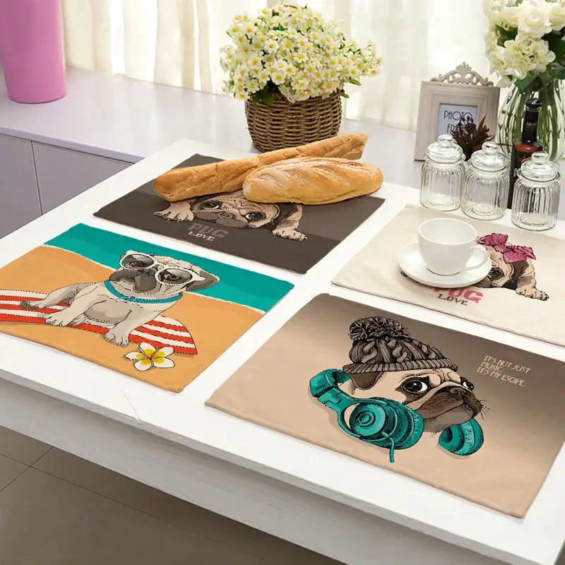 Set of four colorful pug-themed placemats on soft fabric from decorbites cute dog linen dining collection