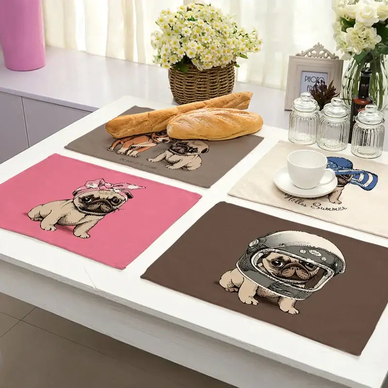 Set of four colorful pug-themed cute dog linen dining placemats featuring cartoon illustrations for decorbites cute dog decor