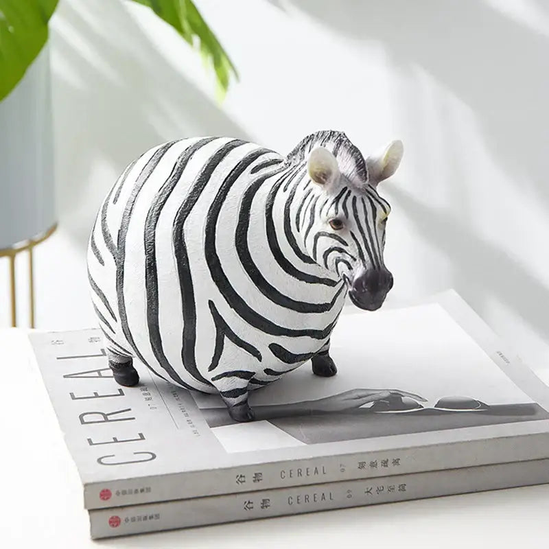 A cute fat zebra resin figurine with black and white stripes and glossy finish for living room decorbites decor