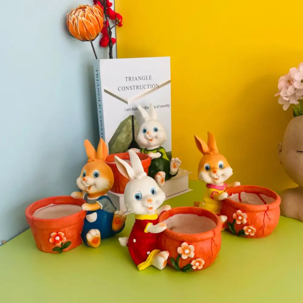 Cute orange ceramic bunny rabbit flower pots with floral decorations and colorful outfits for garden decor