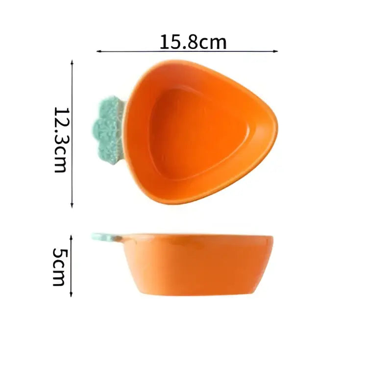 Orange ceramic carrot-shaped pet bowl with green leafy top from cute ceramic tableware set for dining room use