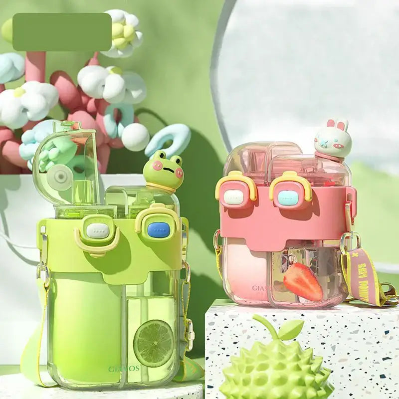 Lime green and pink pastel double-bin sippy cup with cute animal figurines on top for kids kitchen use