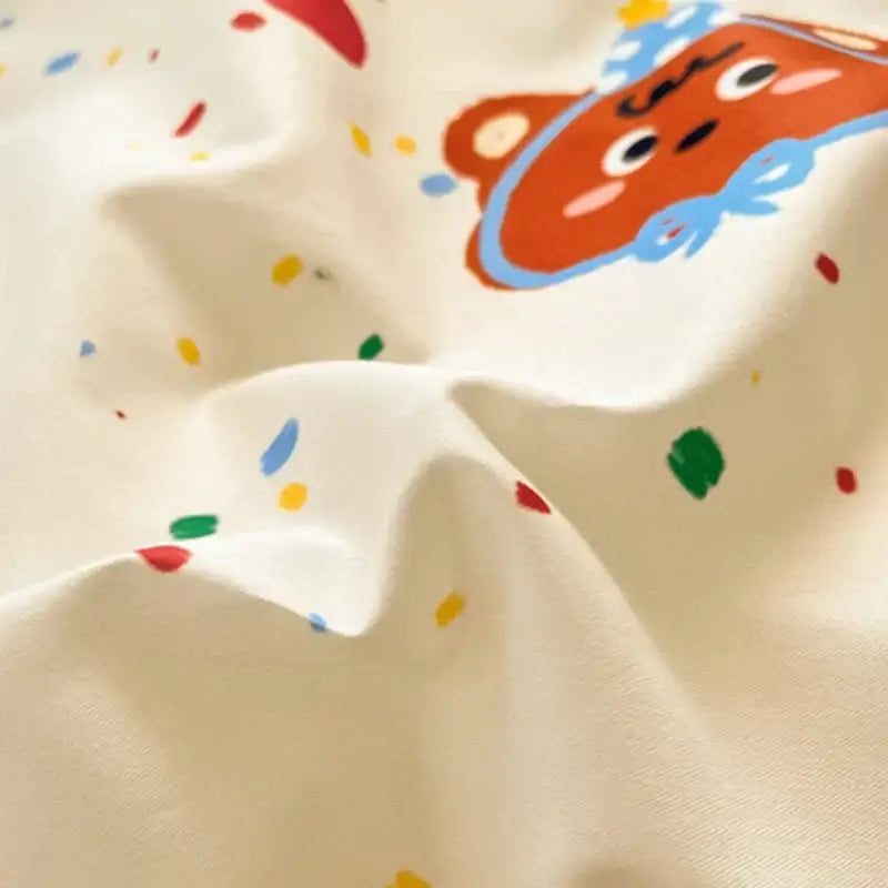 Cream-colored cotton bedding set with a playful pastel bear and multicolored confetti dots floral print by decorbites cotton floral