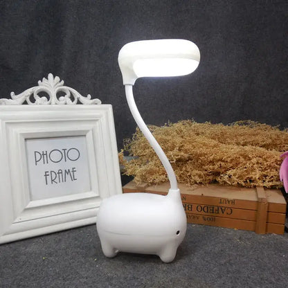 White elephant-shaped led desk lamp with flexible neck and rounded head in decorbites elk night lamp collection