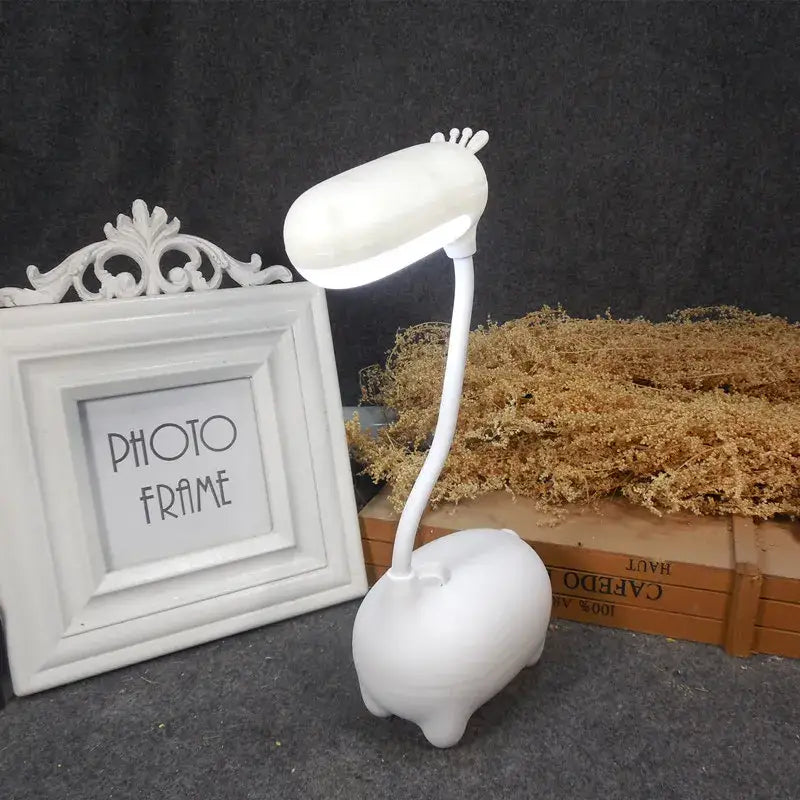 White plastic desk lamp shaped like a pig with flexible neck and head decorbites elk night lamp for bedroom desk decor