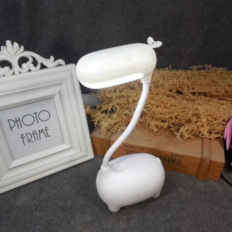 White plush-textured decorbites elk night lamp shaped like a cute pig with small antlers and flexible neck for desk decor