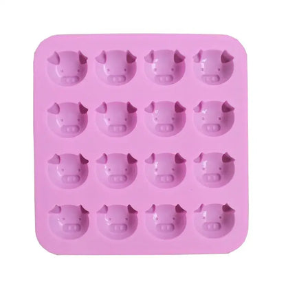 Pink silicone cake mold featuring 16 cute pig head molds ideal for ice cubes or baking purposes