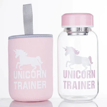 Pink unicorn trainer water bottle with matching pink lid and sleeve beside cute polar bear and seal blue glass water bottle decorbites blue glass water