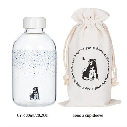 Clear glass water bottle with white cap featuring silver blue glitter gradient and husky illustration by decorbites blue glass water