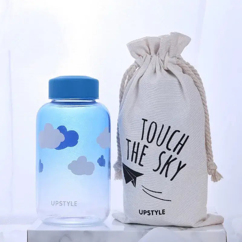 Blue cloud-patterned decorbites blue glass water bottle with matching lid for kitchen drinkware use