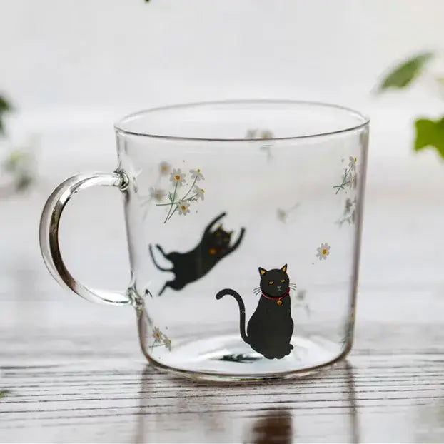 Clear glass coffee mug with black cat illustrations and white daisies heat resistant for kitchen use
